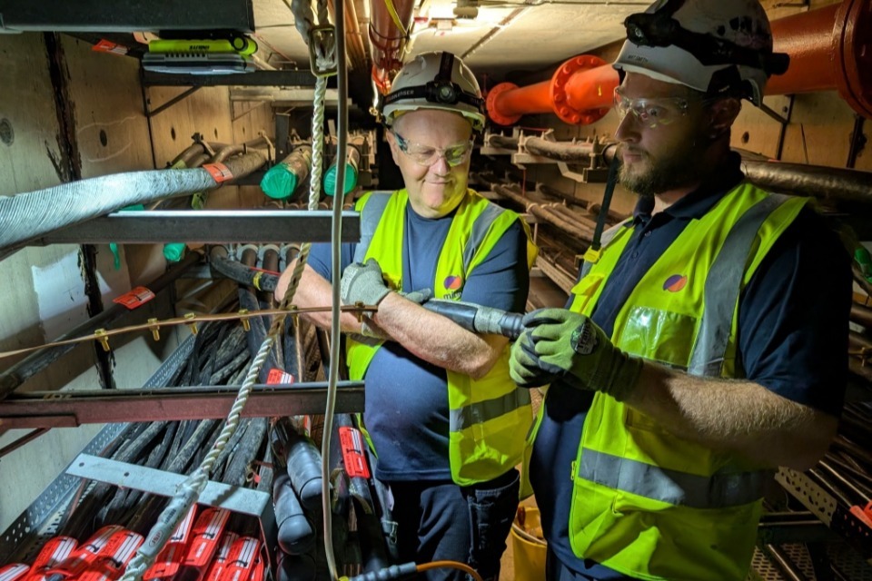 UK nuclear decommissioning personnel carrying out cable work at Oldbury turbine hall. Source: GOV.UK